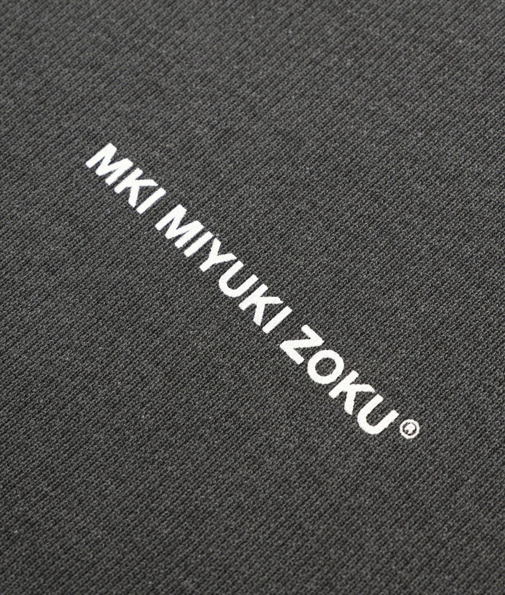 MKI Miyuki Zoku oversized Uniform Crew Sweatshirt in Pigment Black at EQVVS Menswear. Detail shot.