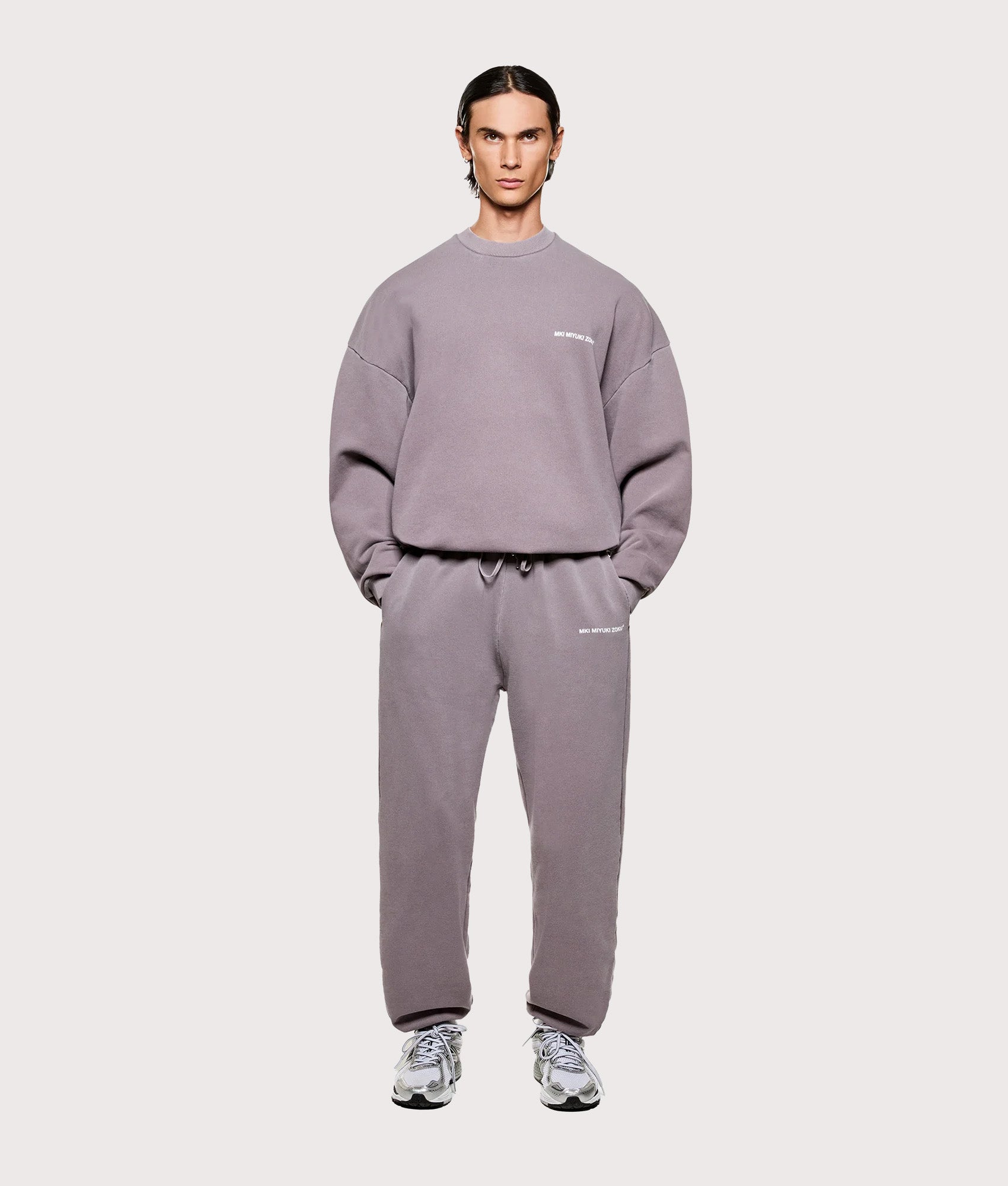 MKI MIYUKI ZOKU Oversized Uniform Crewneck Sweatshirt in Pigment Raisin at EQVVS Menswear. Model full front shot.