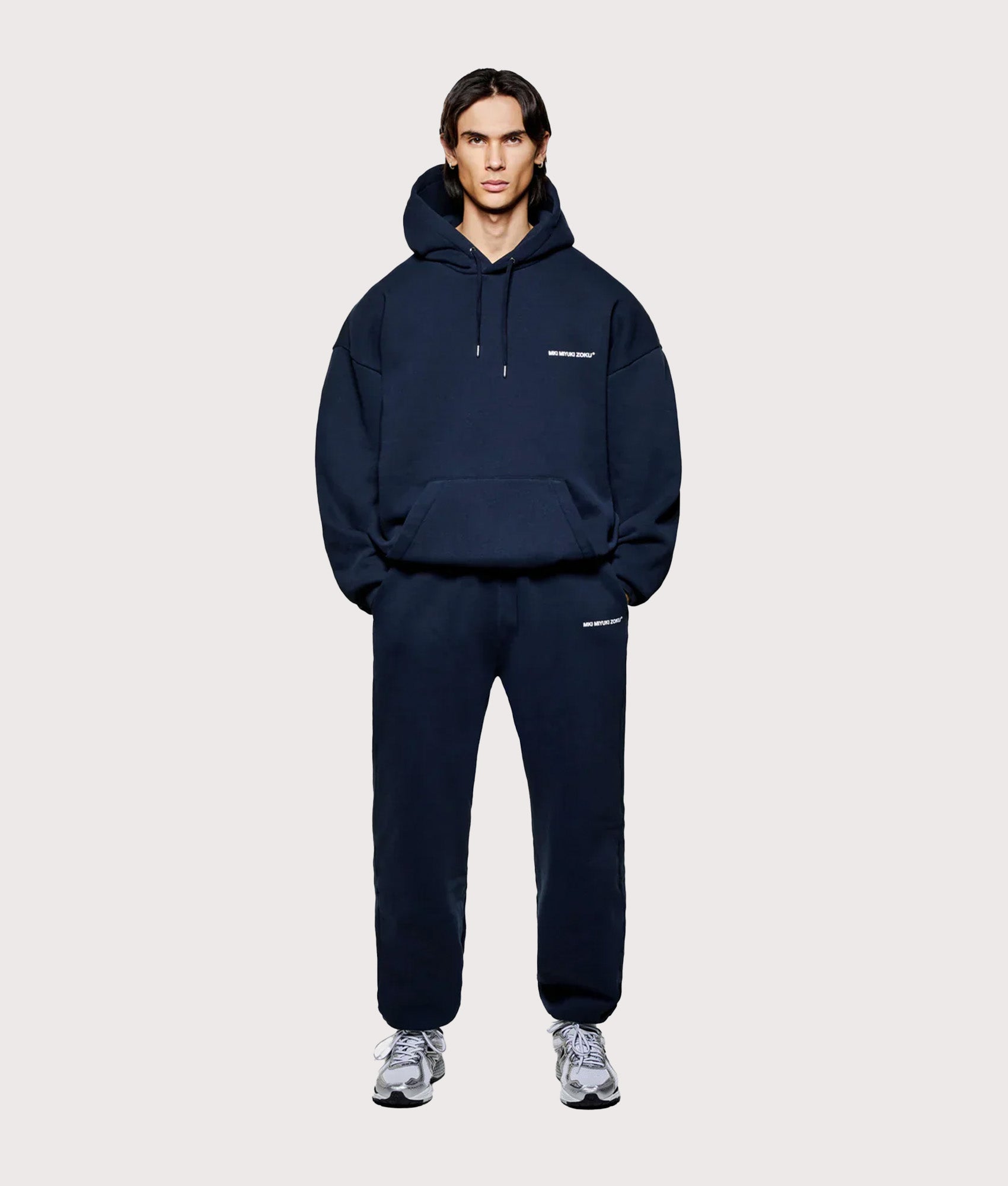 MKI MIYUKI ZOKU Oversized Uniform Hoodie in Navy at EQVVS Menswear. Model full front shot.