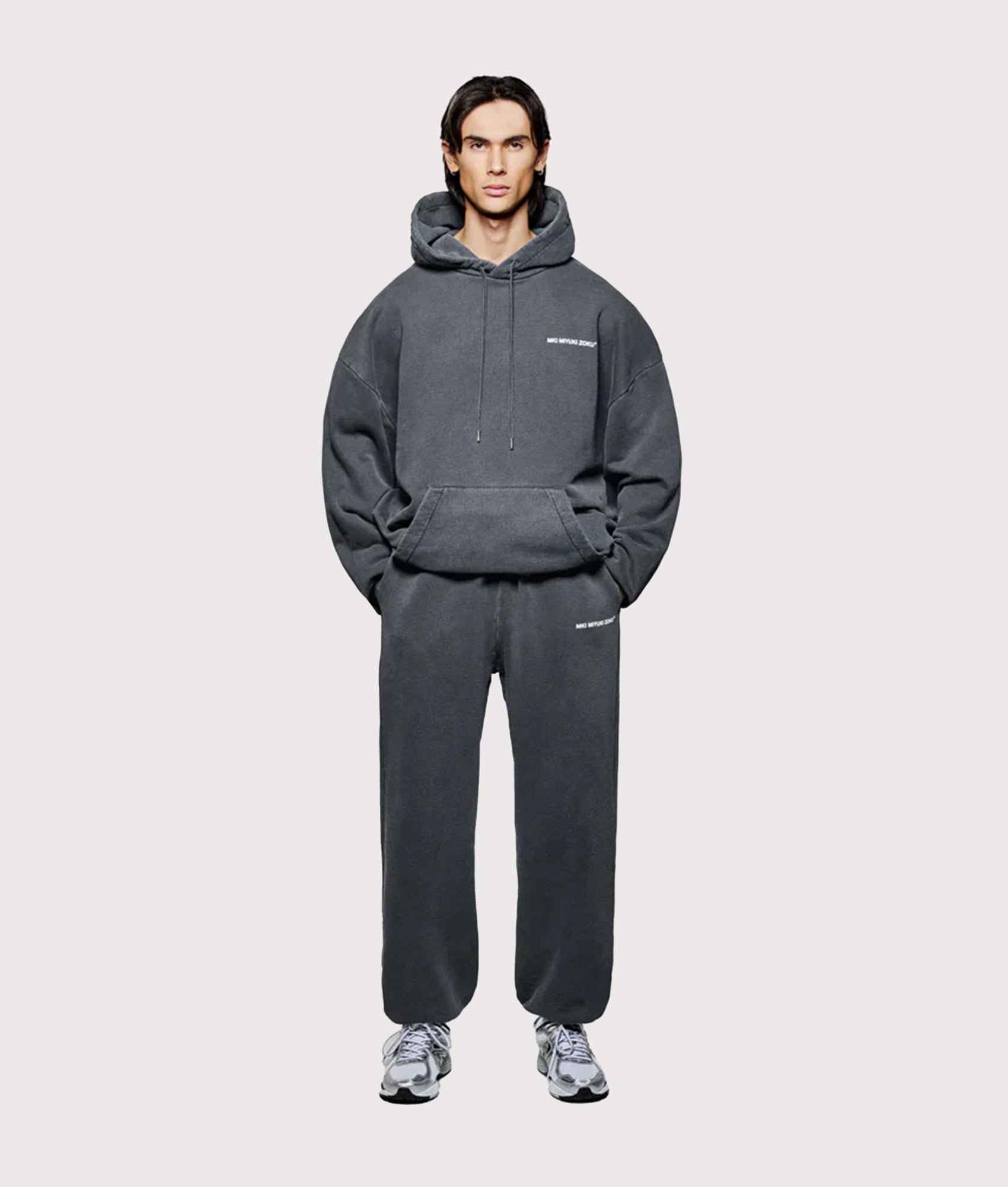 MKI Miyuki Zoku Oversized Uniform Hoodie in Pigment Black at EQVVS Menswear. Full model front shot.