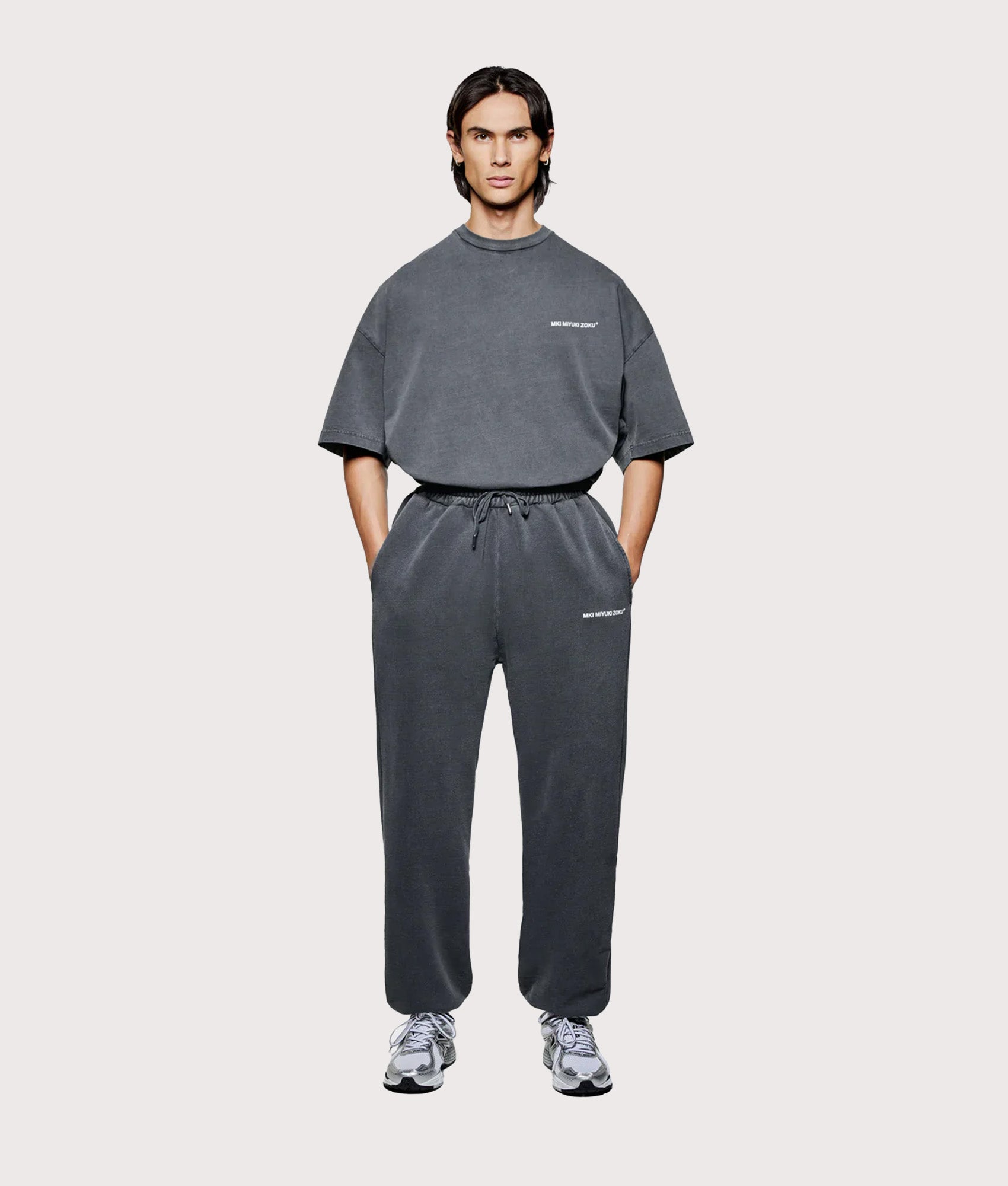 MKI Miyuki Zoku Uniform Joggers in PIgment Black at EQVVS Menswear. Model full front shot.
