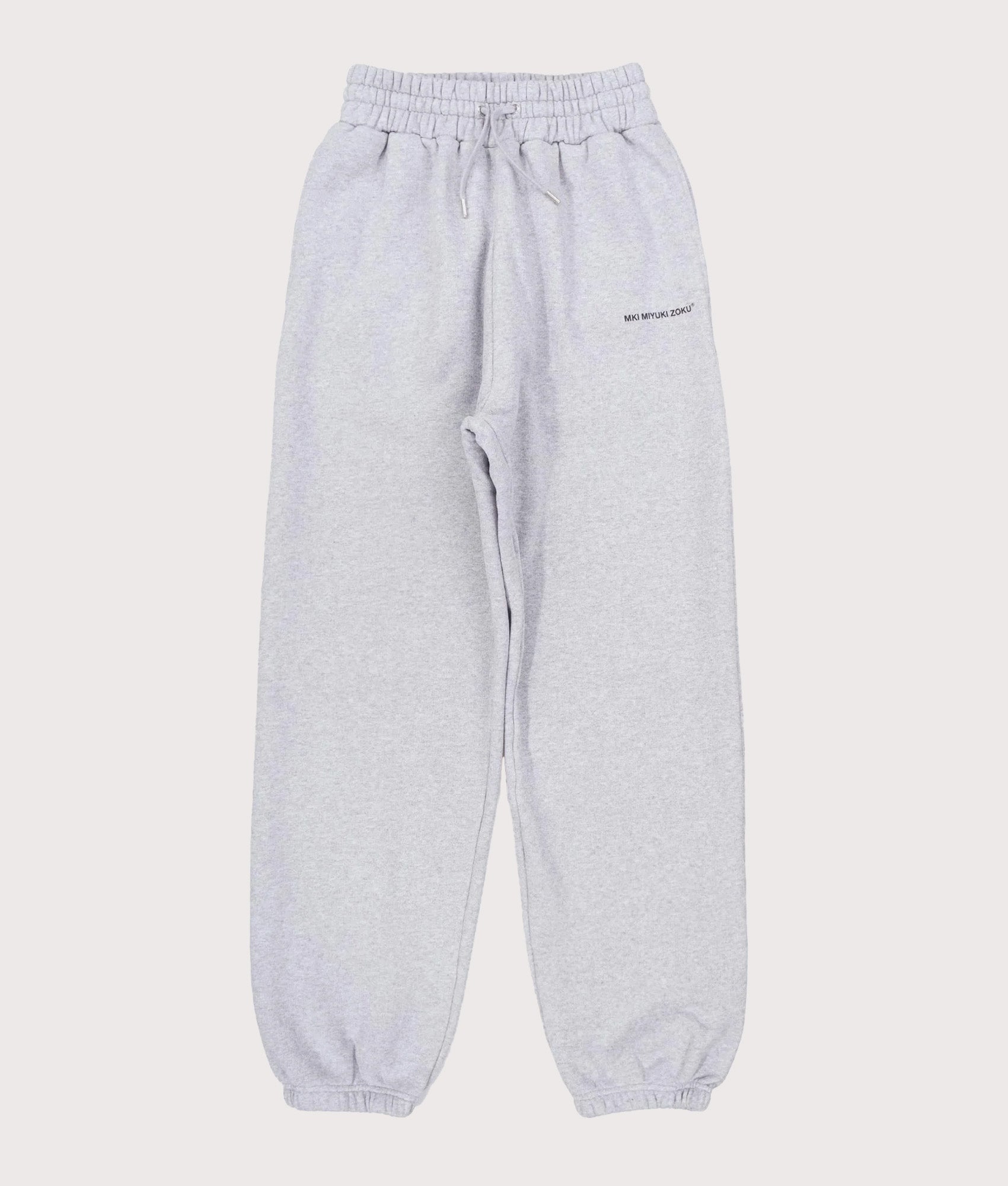 MKI MIYUKI ZOKU Uniform Joggers in Grey at EQVVS Menswear. Front flat shot.