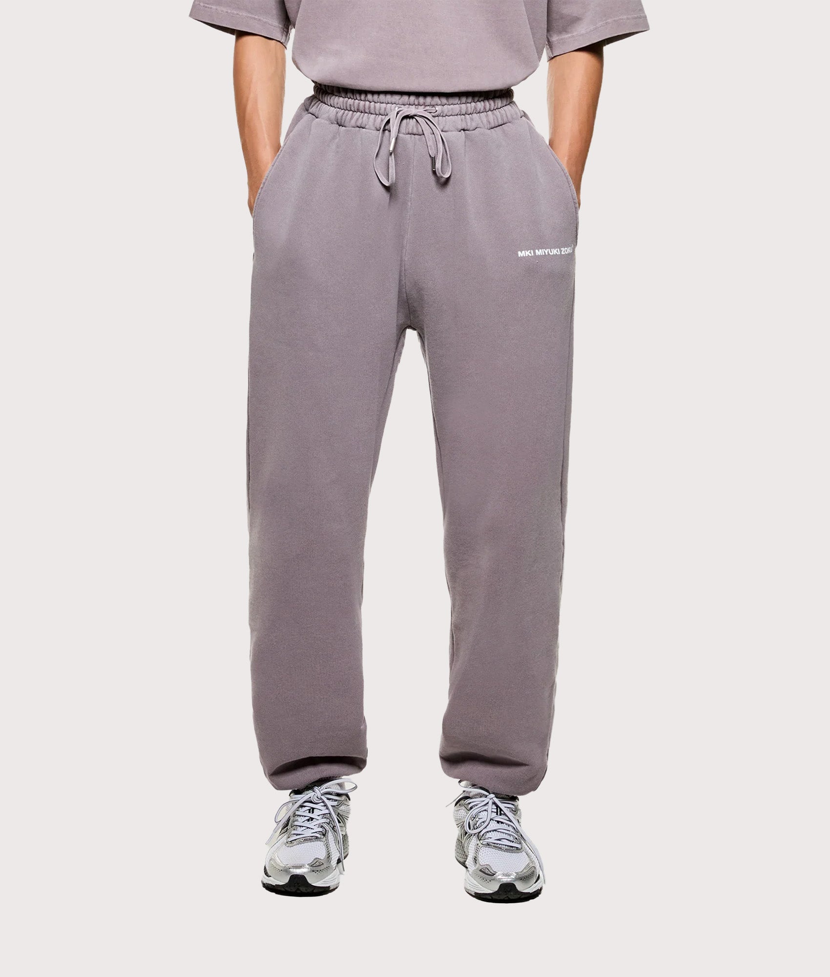 MKI MIYUKI ZOKU Uniform Joggers in  Pigment Raisin at EQVVS Menswear. Model front shot.