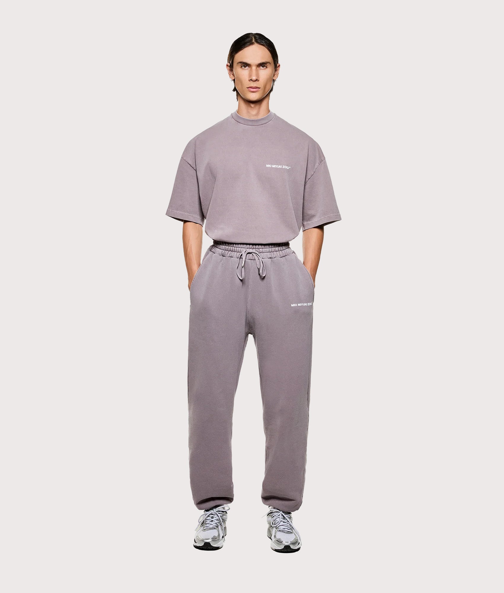 MKI MIYUKI ZOKU Uniform Joggers in  Pigment Raisin at EQVVS Menswear. Model full front shot.