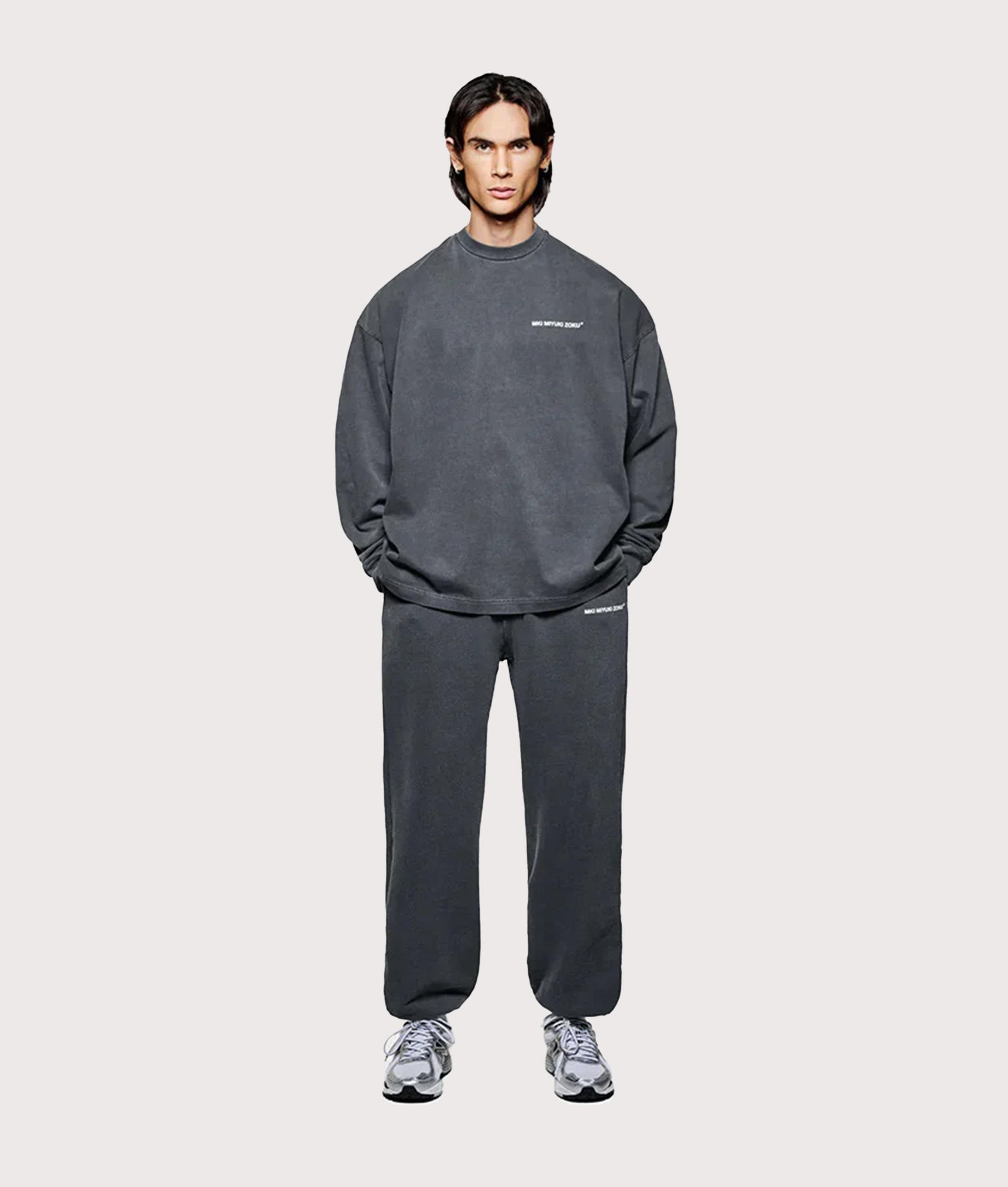 MKI Miyuki Zoku Long Sleeve Uniform T-Shirt in Pigment Black at EQVVS Menswear. Model full front shot.