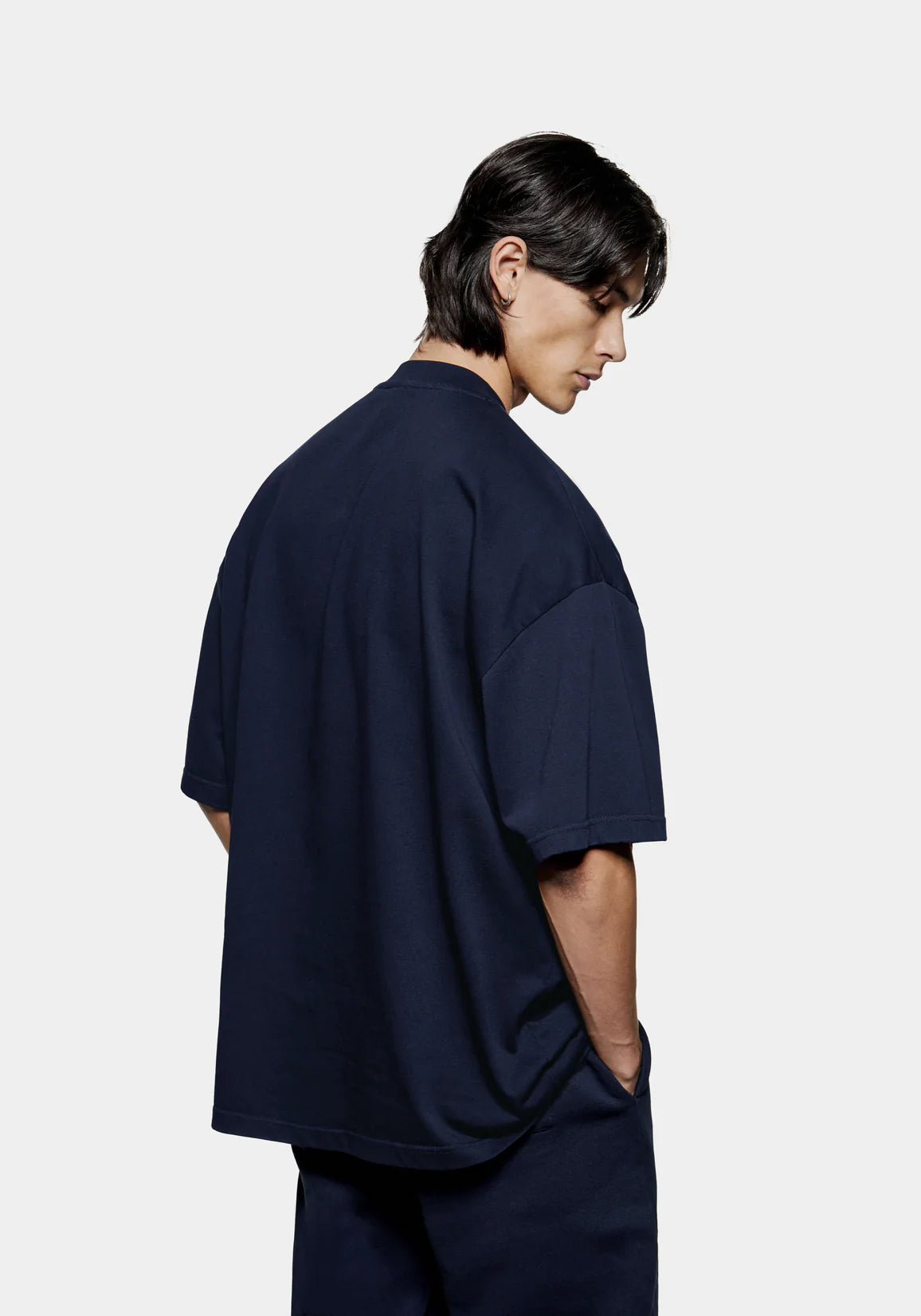 MKI Miyuki Zoku Uniform T-Shirt in Navy. Shot at EQVVS. Model reverse shot. 