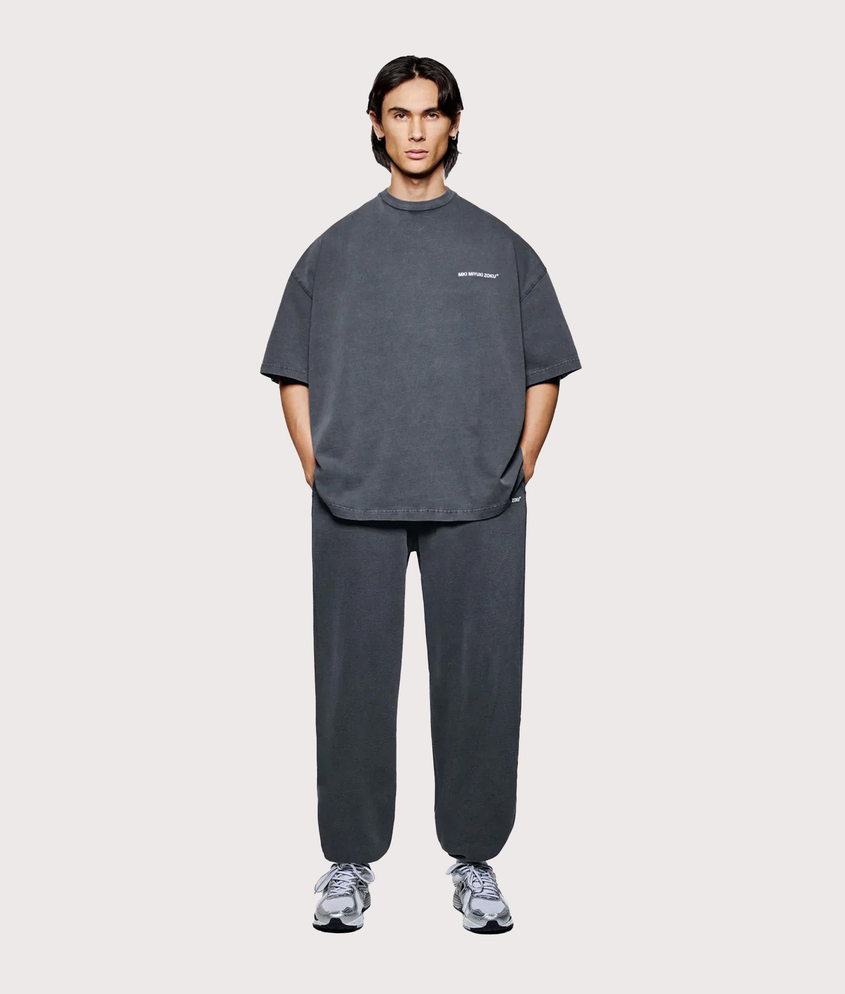 MKI MIYUKI ZOKU Oversized Uniform T-Shirt in Pigment Black at EQVVS Menswear. Model full front shot.
