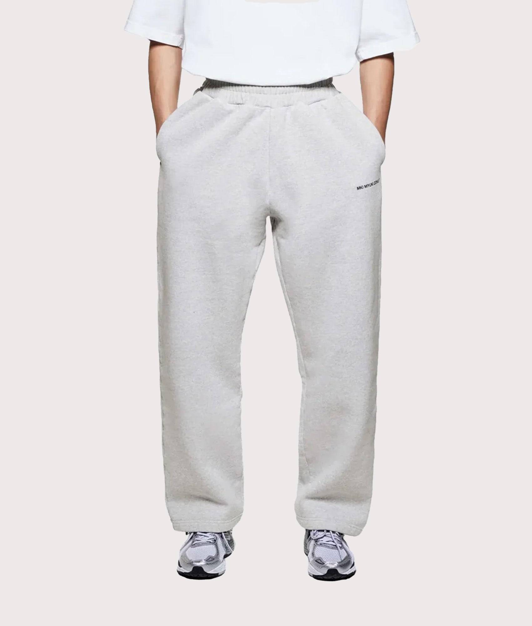 MKI MIYUKI ZOKU Uniform Wide Leg Joggers in grey at EQVVS Menswear. Model front shot.