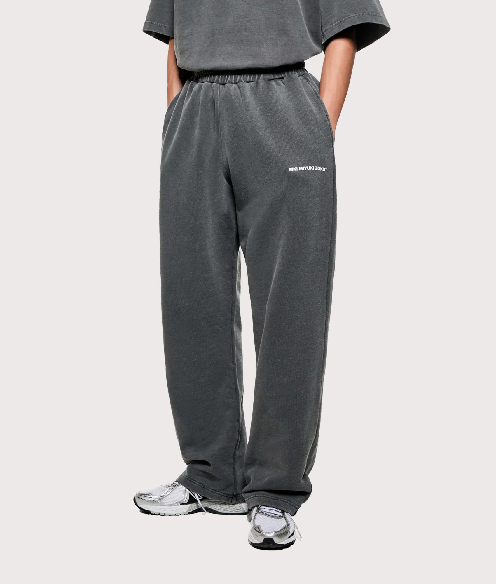 MKI MIYUKI ZOKU Uniform Wide Leg Joggers arrive in the Pigment Black at EQVVS Menswear. Angled model front shot.