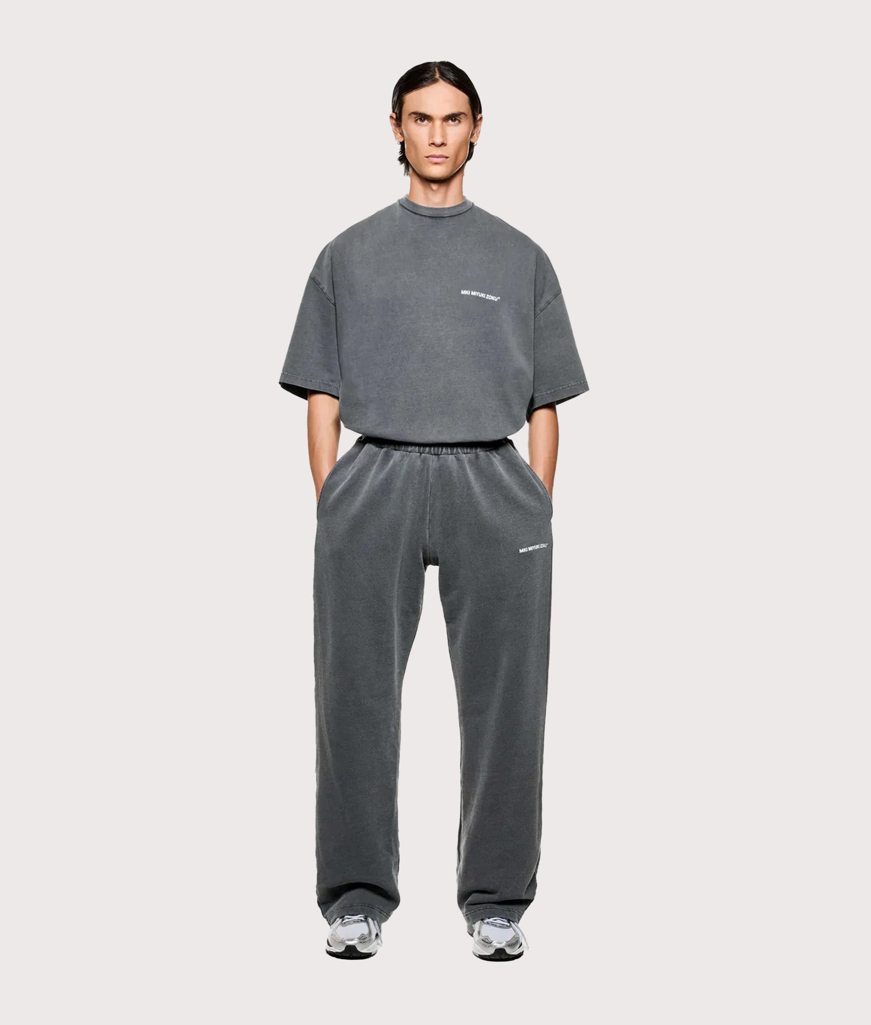 MKI MIYUKI ZOKU Uniform Wide Leg Joggers arrive in the Pigment Black at EQVVS Menswear. Model full front shot.
