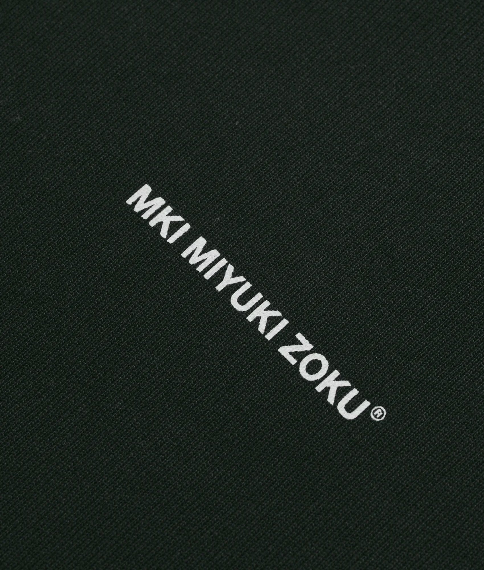 MKI MIYUKI ZOKU Oversized Uniform Zip Through Hoodie in Green at EQVVS Menswear. Detail shot.
