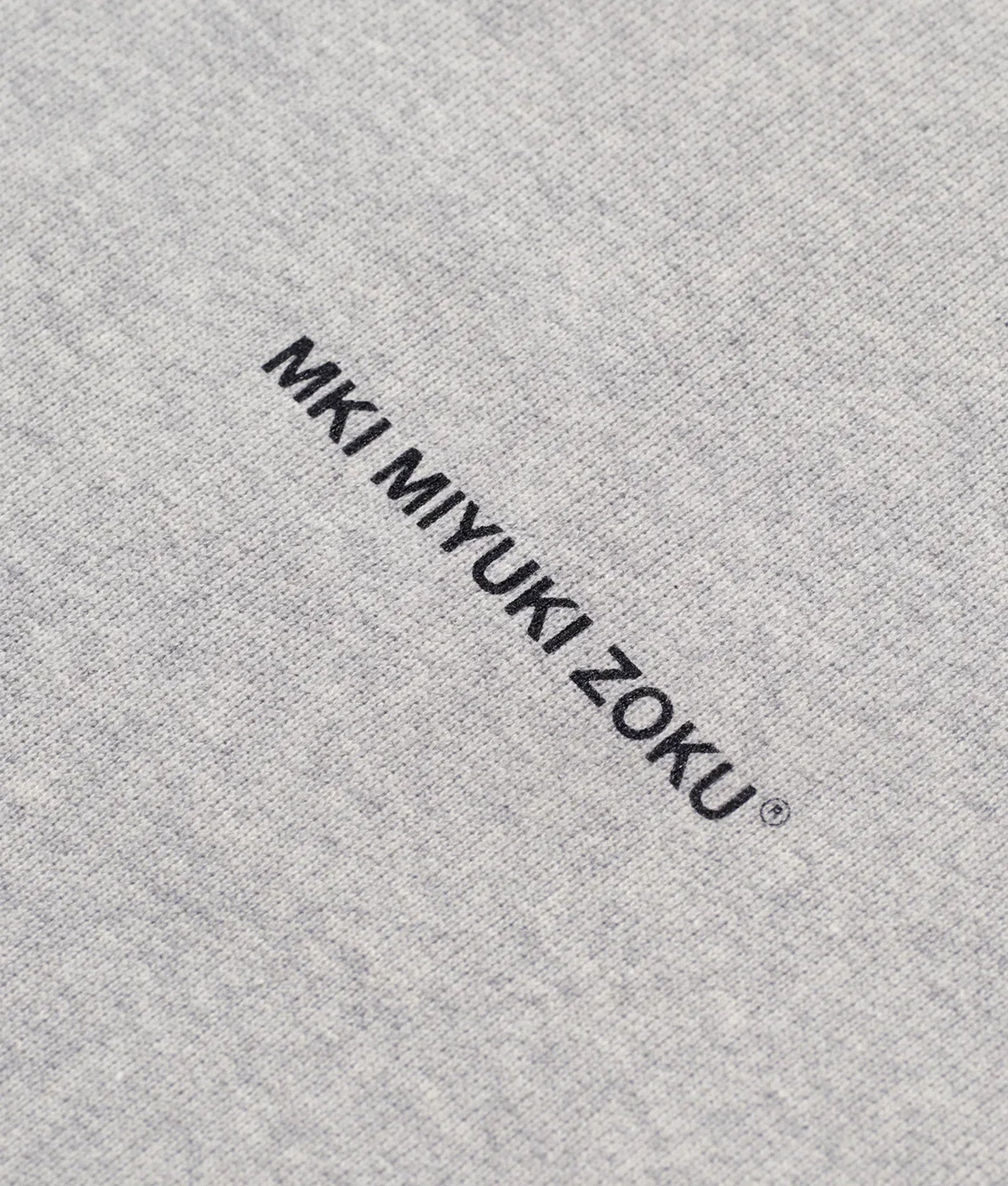 MKI MIYUKI ZOKU Oversized Uniform zip through hoodie in Grey at EQVVS Menswear. Detail shot.