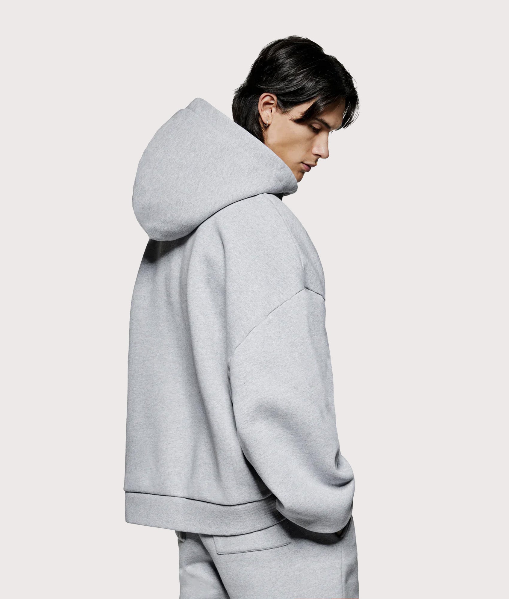 MKI MIYUKI ZOKU Oversized Uniform zip through hoodie in Grey at EQVVS Menswear. Angled model Back shot.