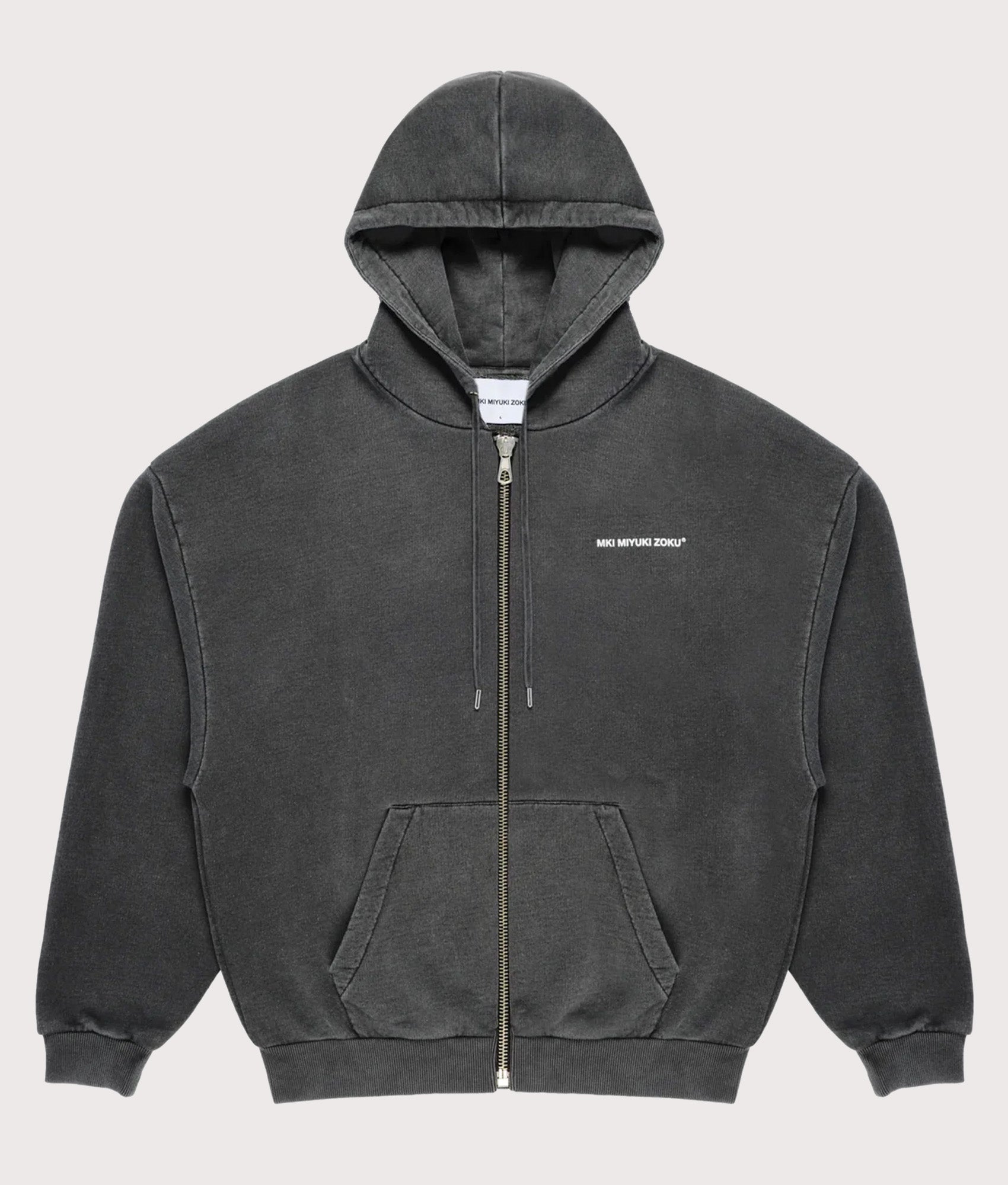 MKI MIYUKI ZOKU Oversized Uniform Zip Through Hoodie in Pigment Black at EQVVS Menswear. Front shot
