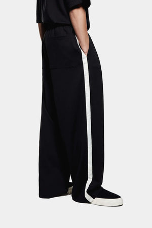 Wide fit track pants MKI Miyuki Zoku black. Model shot, 