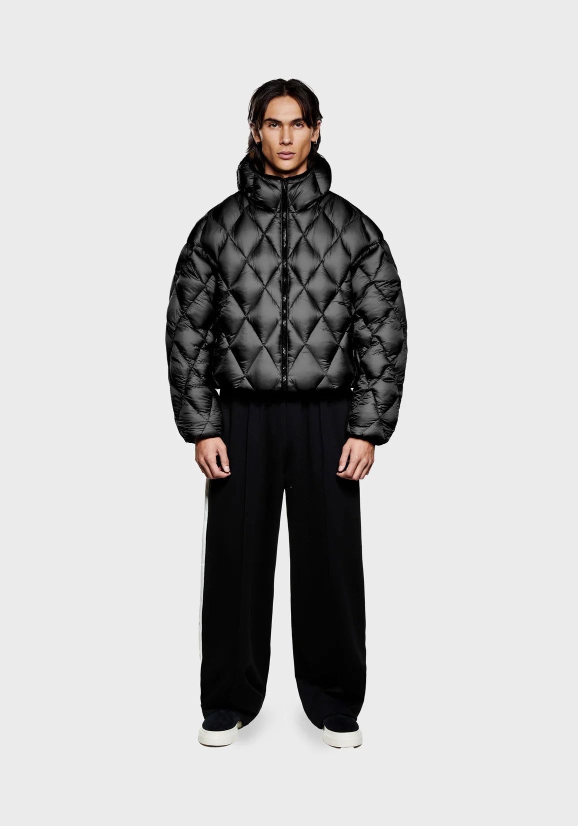Diamond Bubble Jacket in black by MKI Miyuki Zoku. Model shot. 