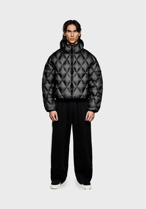 Diamond Bubble Jacket in black by MKI Miyuki Zoku. Model shot. 