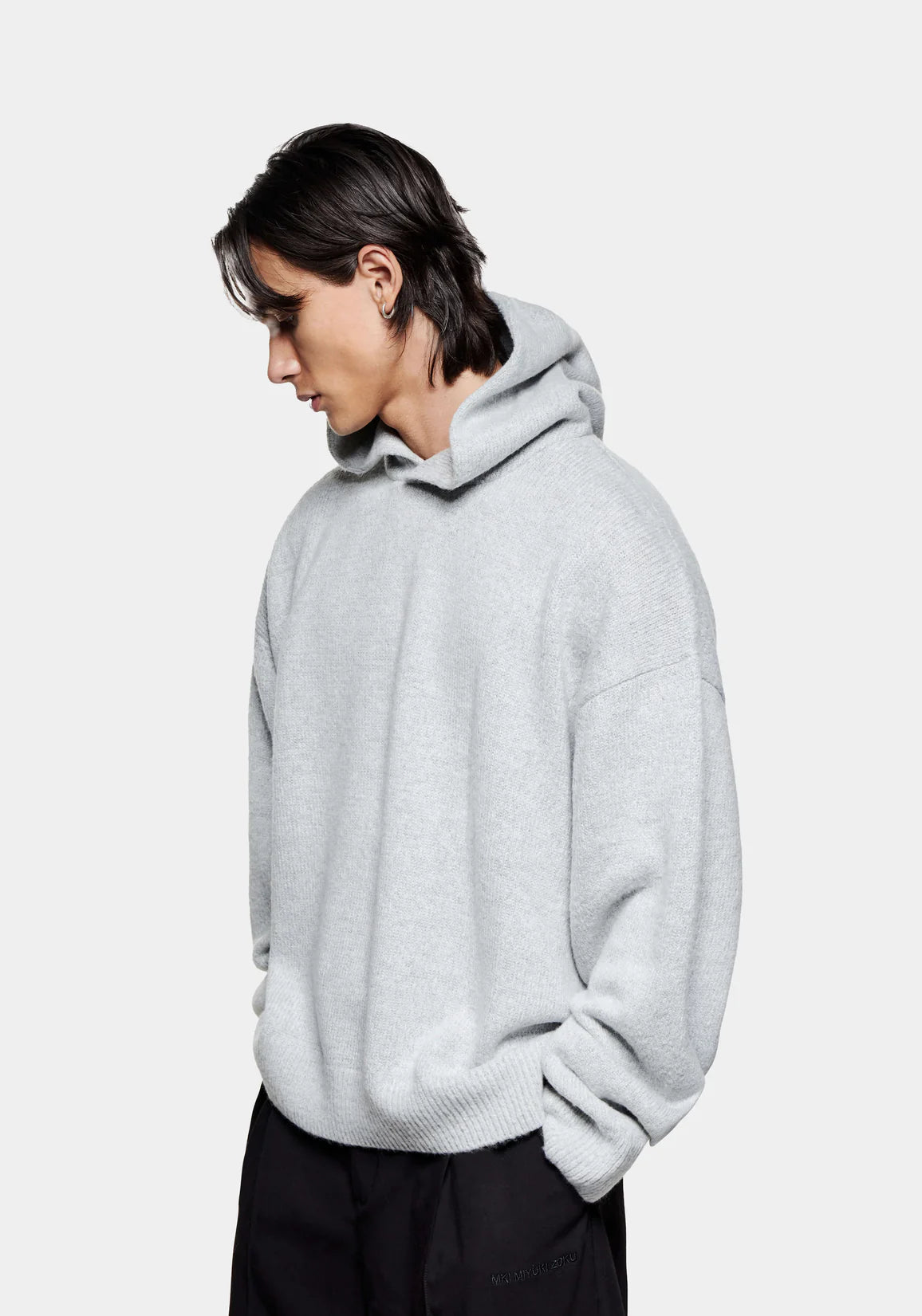 MKI MIYUKI ZOKU Mohair Blend Knit Hoodie in Light Grey at EQVVS Menswear. Side Model Shot.