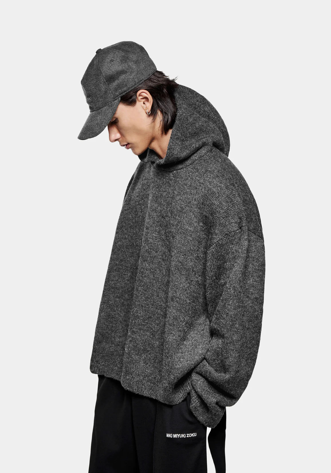 MKI MIYUKI ZOKU Mohair Blend Knit Hoodie in Charcoal at EQVVS Menswear. Side Model Shot. 