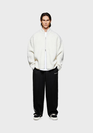 MKI Miyuki Zoku Chunky Rib Knit Track Jacket in Off White at EQVVS. Model Front Shot.