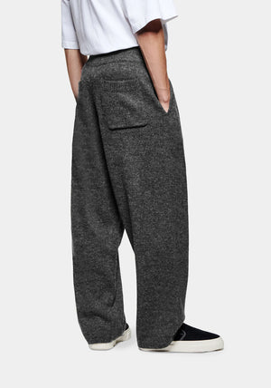 Mohair Blend Knit Wide Leg Joggers in Charcoal by MKI MIYUKI ZOKU at EQVVS. Side Model Shot. 