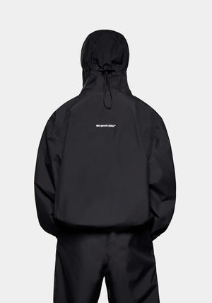 MKI MIYUKI ZOKU Relaxed Fit V2 Shell Hooded Jacket in Black at EQVVS Menswear. Back Model Shot.