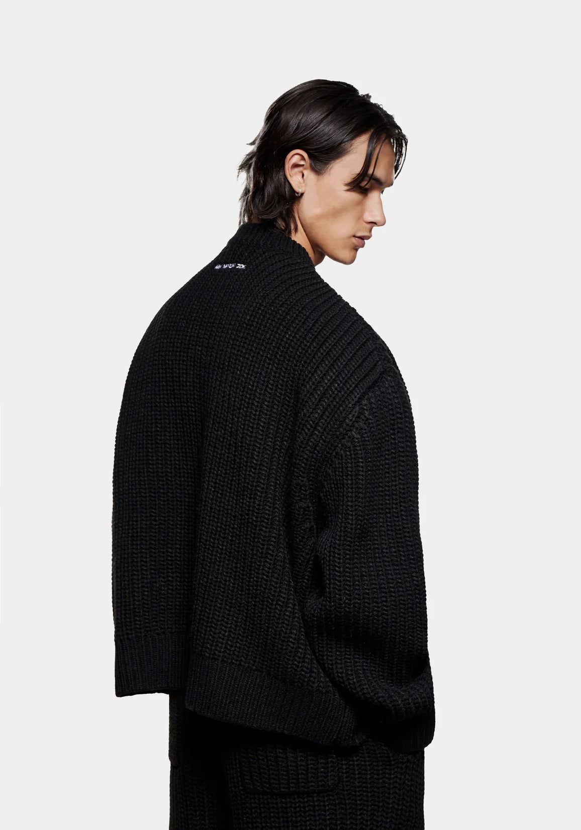 MKI Miyuki Zoku Chunky Rib Knit Crewneck Jumper in Black. Model Back Angle Shot.
