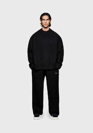 MKI Miyuki Zoku Chunky Rib Knit Crewneck Jumper in Black. Model Front Shot.