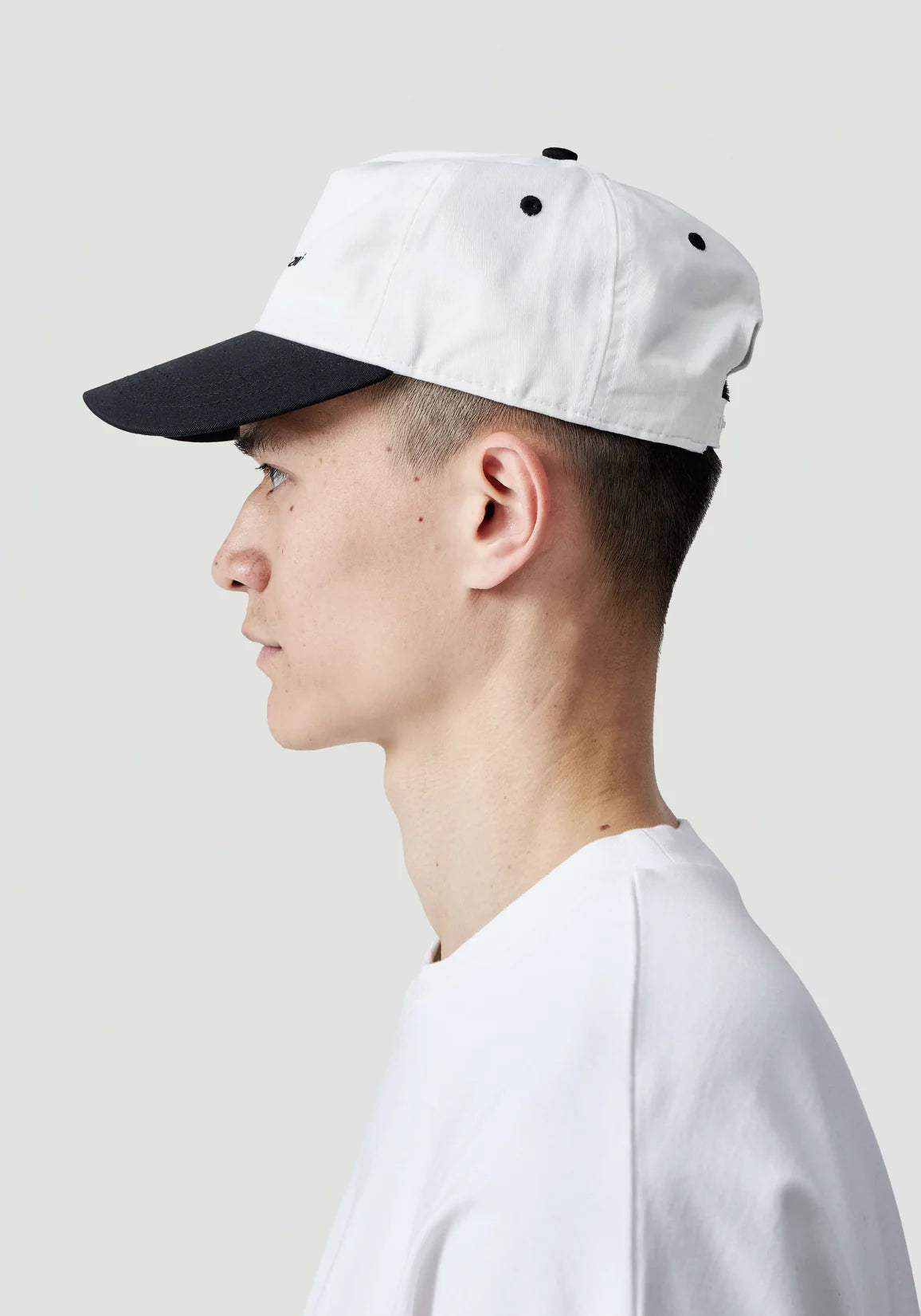 V2 Twill Ball Cap in Contrast White and Black by MKI MIYUKI ZOKU at EQVVS. Side Model Shot. 