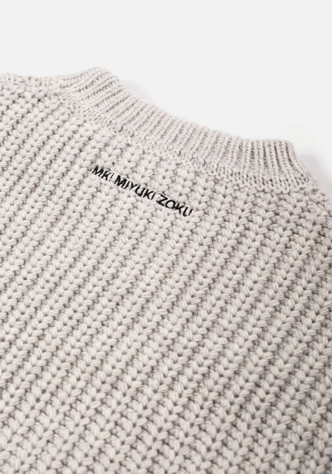 MKI Miyuki Zoku Chunky Rib Knit Crewneck Jumper in Grey. Embroidery Shot.