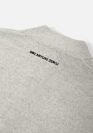 Mohair Blend Knit Track Jacket in Light Grey by MKI MIYUKI ZOKU at EQVVS Menswear. Logo Detail Shot.