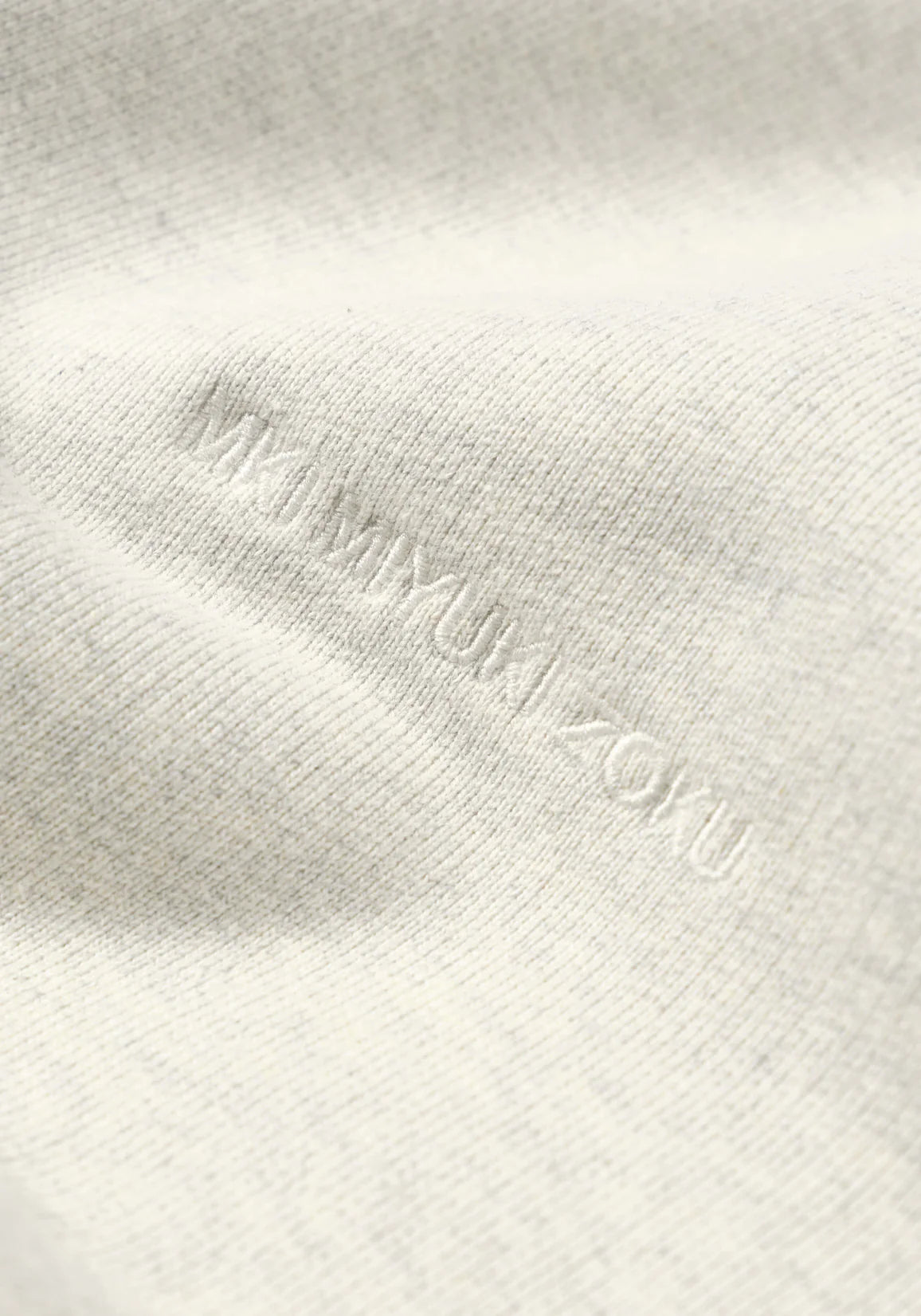 MKI MIYUKI ZOKU Oversized 800 GSM Superweight Sweatshirt in Oatmeal at EQVVS Menswear. Logo Detail Shot. 