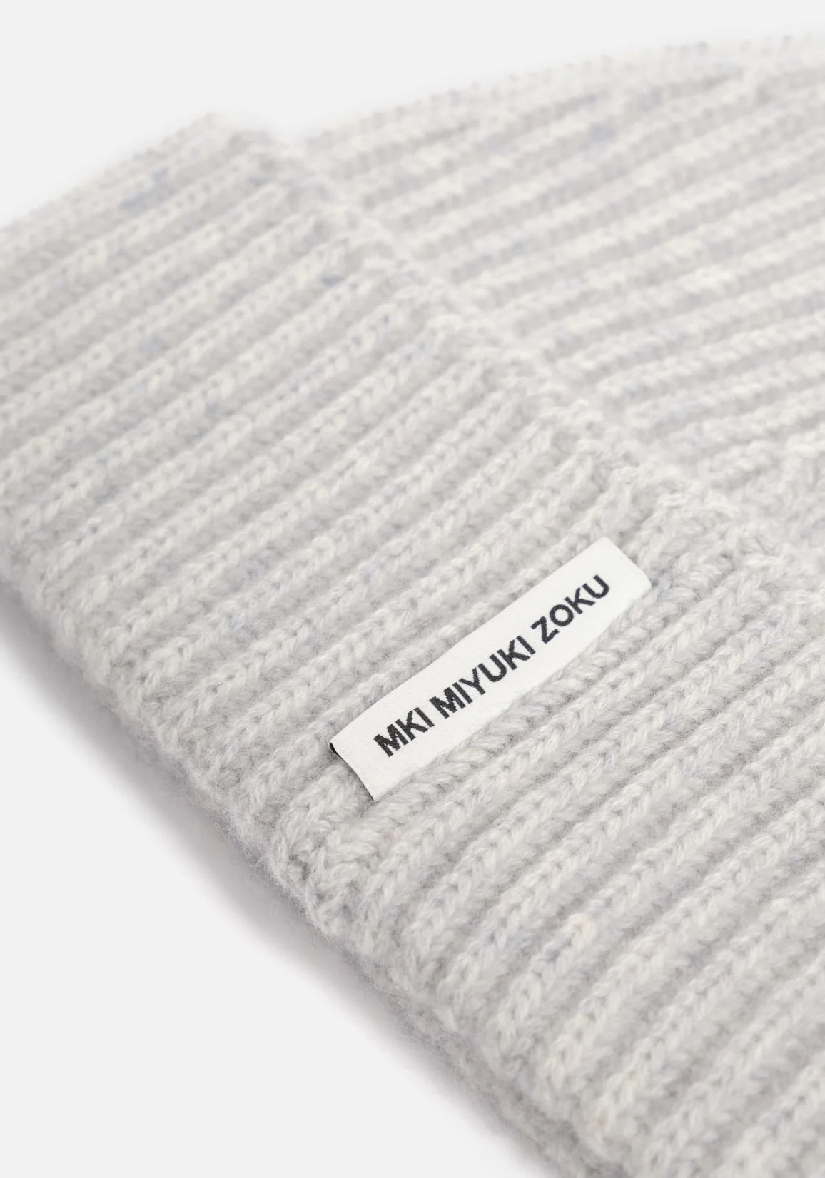 Detail shot MKI Grey Cashmere Ribbed Beanie. 
