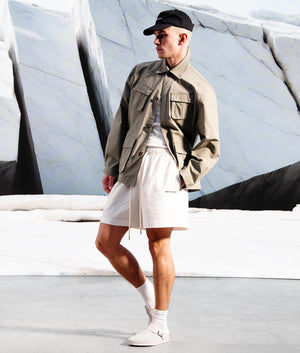 Relaxed Fit Seersucker Shorts in Off White by MKI MIYUKI ZOKU. Campaign Shot.
