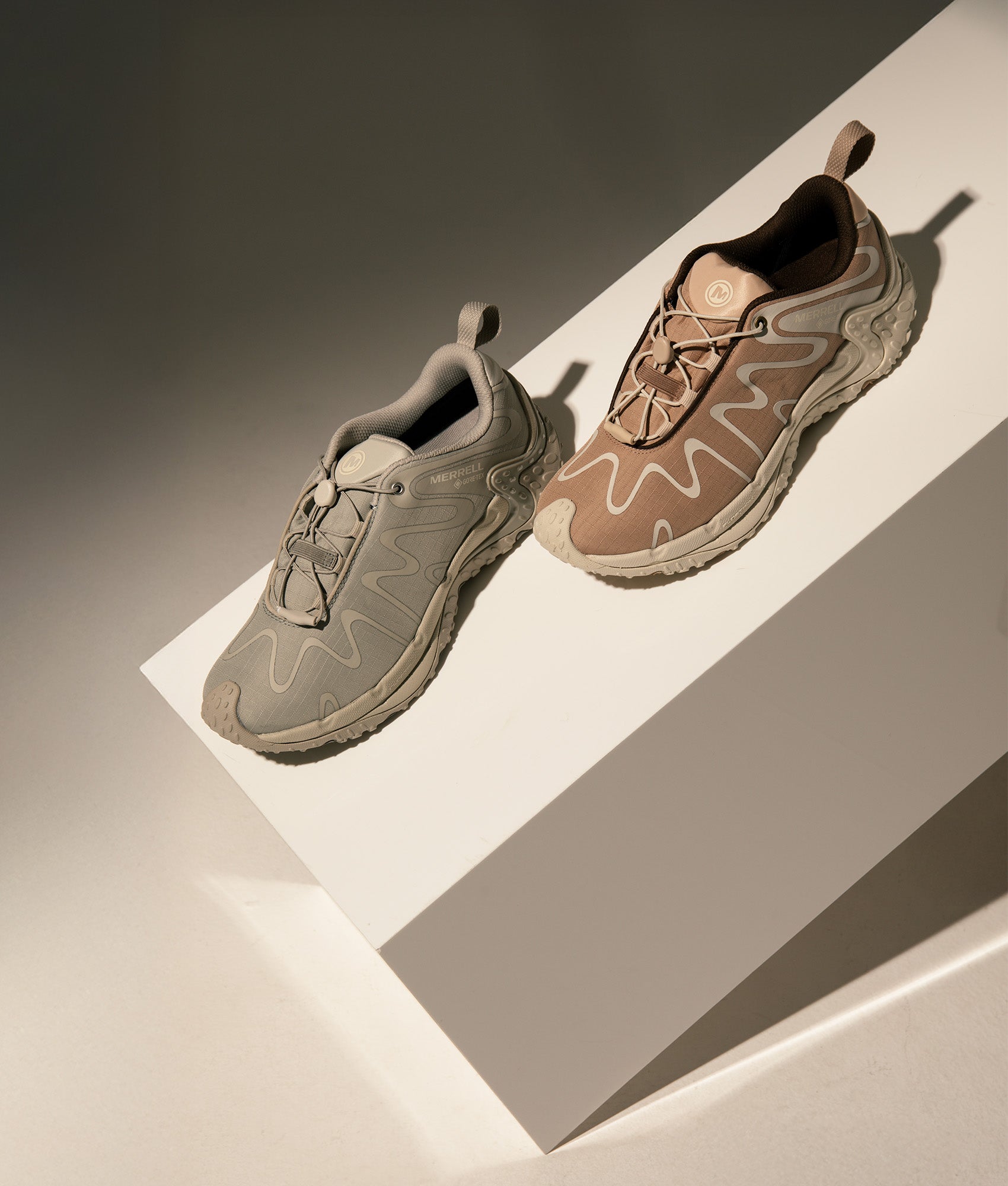 Cham Redux Storm Gtx Se Trainers by Merrell in Hazel. Shot by EQVVS. Campaign shot.