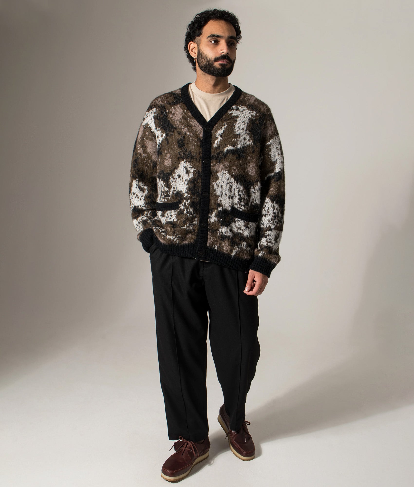 Carhartt WIP Merton Cardigan in Wild Dog Jacquard at EQVVS Menswear. Model shot.