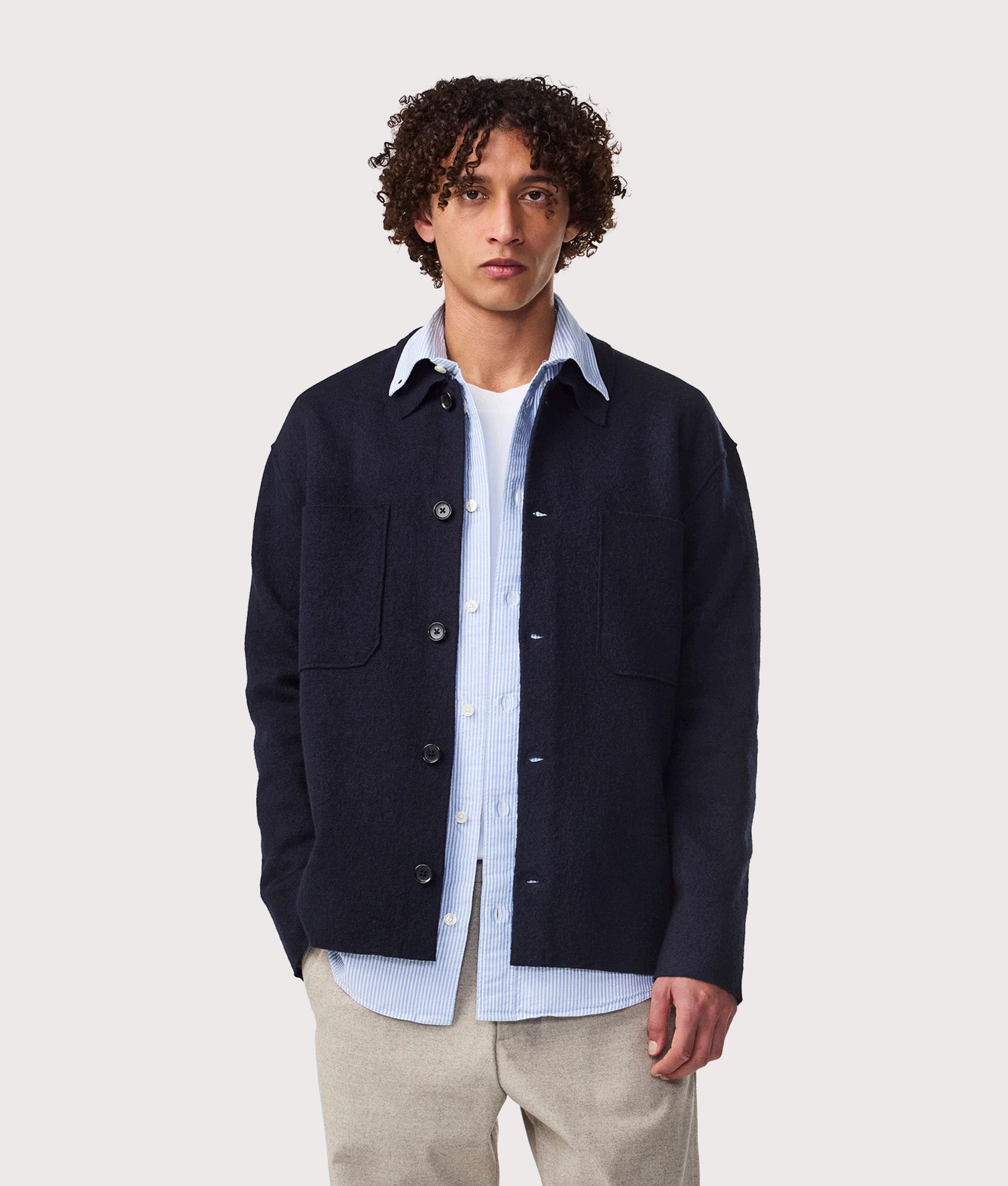 NN.07 Jonas Wool Overshirt in Navy Blue at EQVVS Menswear. Model front shot.