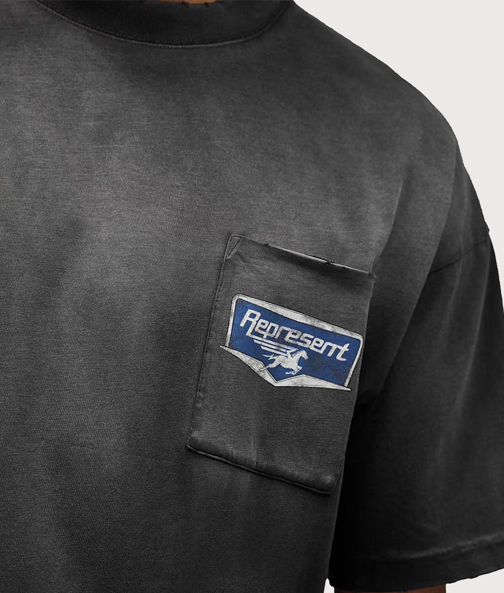 Represent Oversized Fit Nothing Faster T-Shirt in Stained Black at EQVVS Menswear. Detail shot.