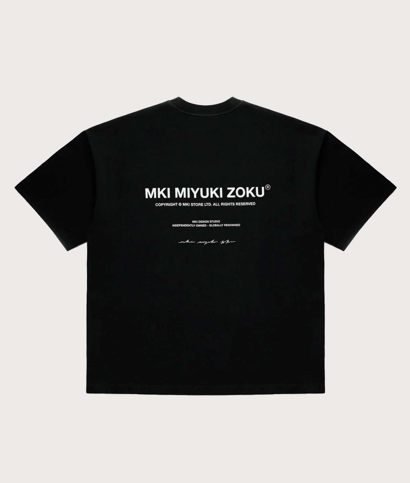 MKI MIYUKI ZOKU Oversized Fit Design Studio T-Shirt in Black at EQVVS Menswear. Back shot.