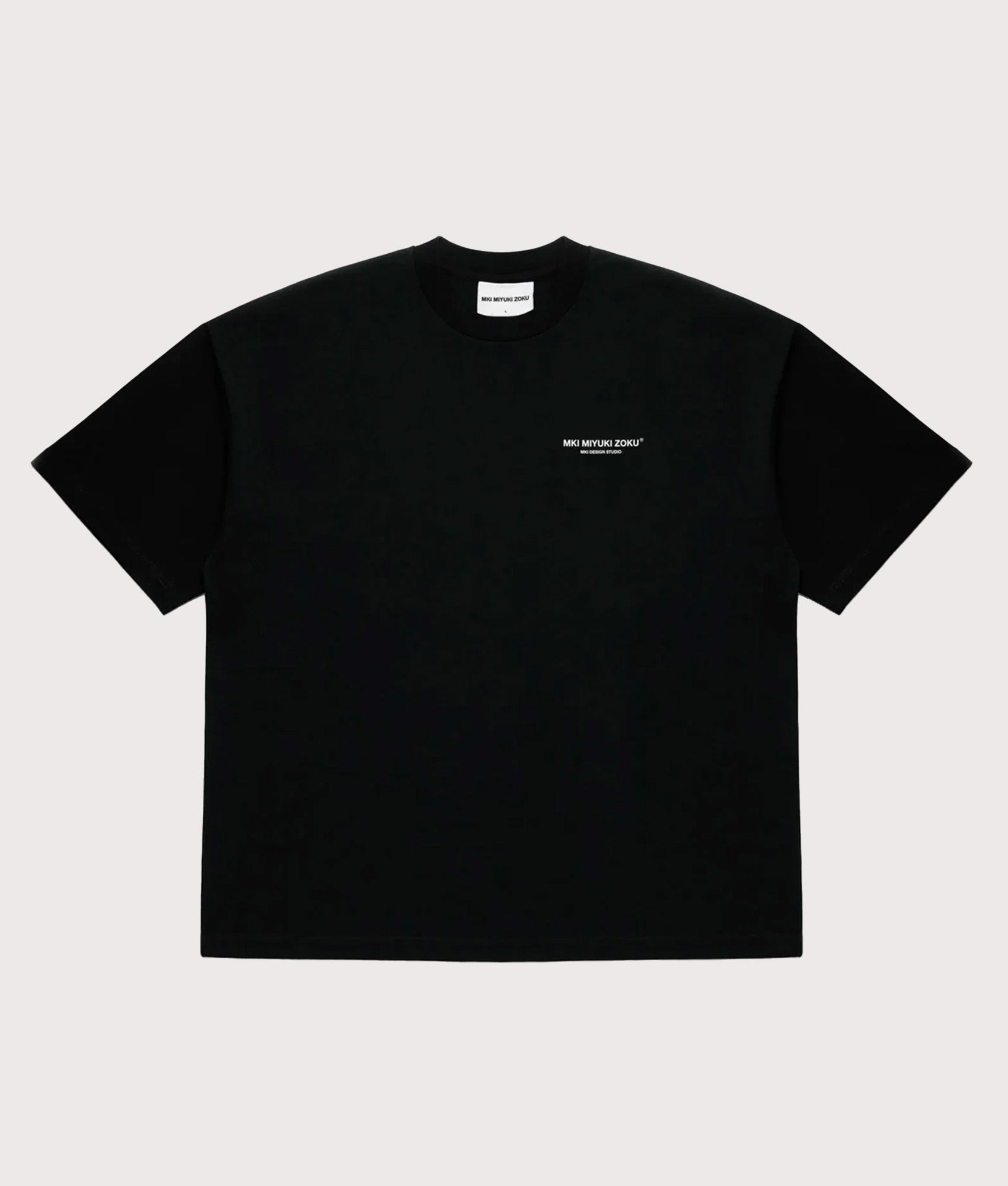 MKI MIYUKI ZOKU Oversized Fit Design Studio T-Shirt in Black at EQVVS Menswear. Front shot.