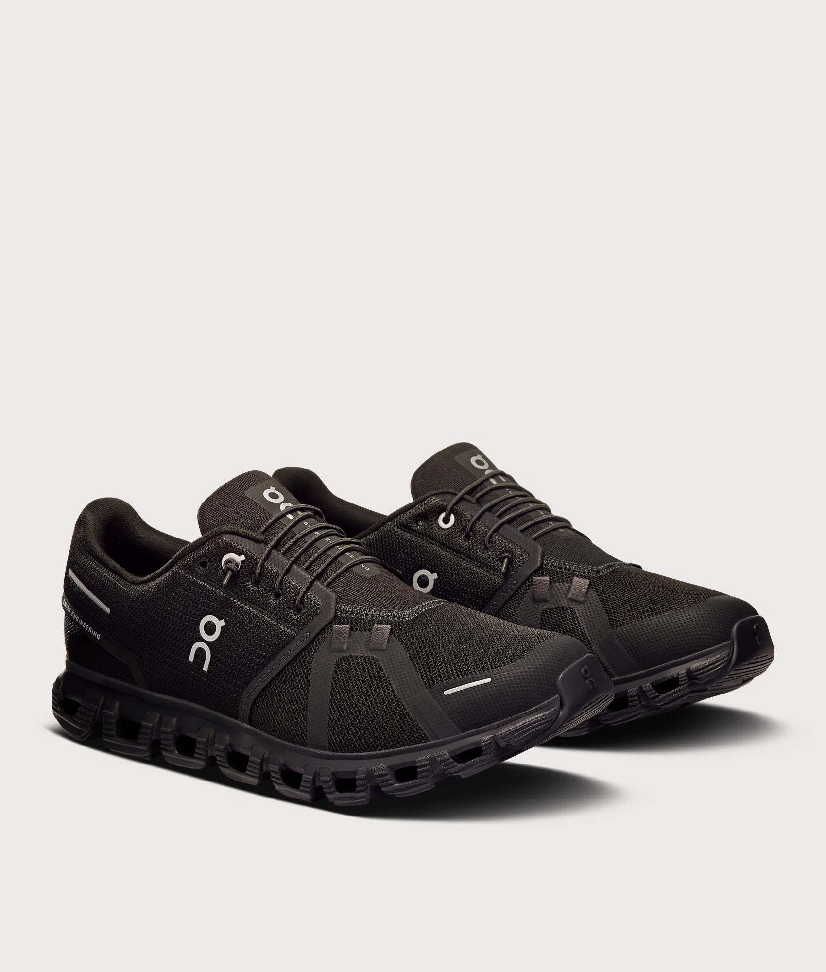 On Cloud 6 Sneakers in Black/Black at EQVVS Menswear. Angled side shot.
