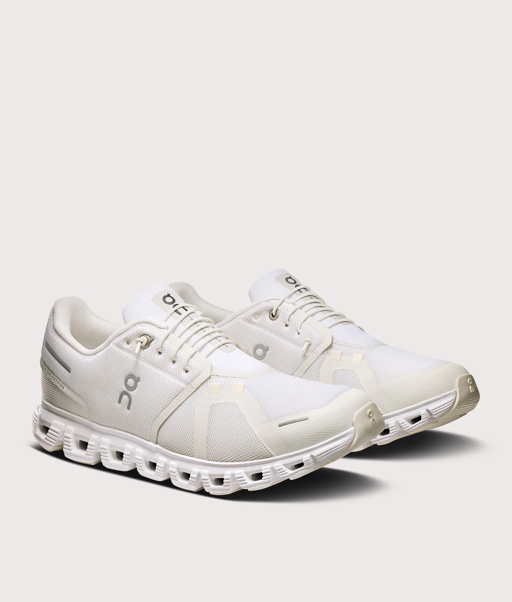 On Cloud 6 Sneakers in White on White at EQVVS Menswear. Angled front shot.