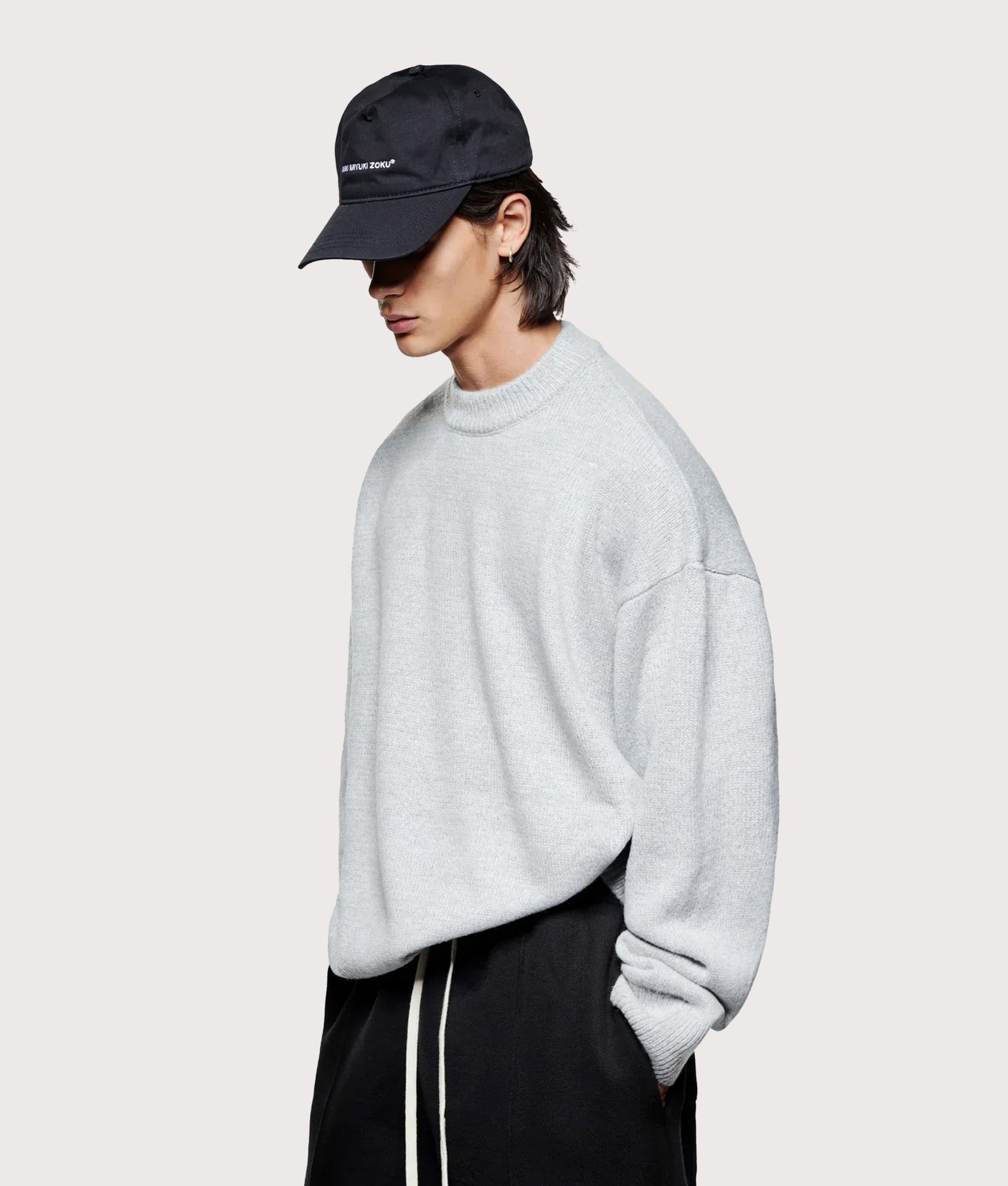 MKI Miyuki Zoku Oversized Mohair Blend Knit Crew Jumper in Light Grey at EQVVS Menswear. Angled model front shot.