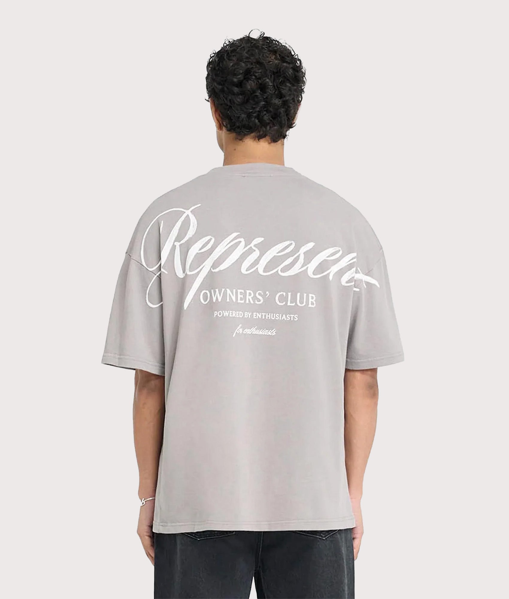 REPRESENT Oversized Represent Owners Club Script T-Shirt in Slate at EQVVS Menswear. Model back shot.
