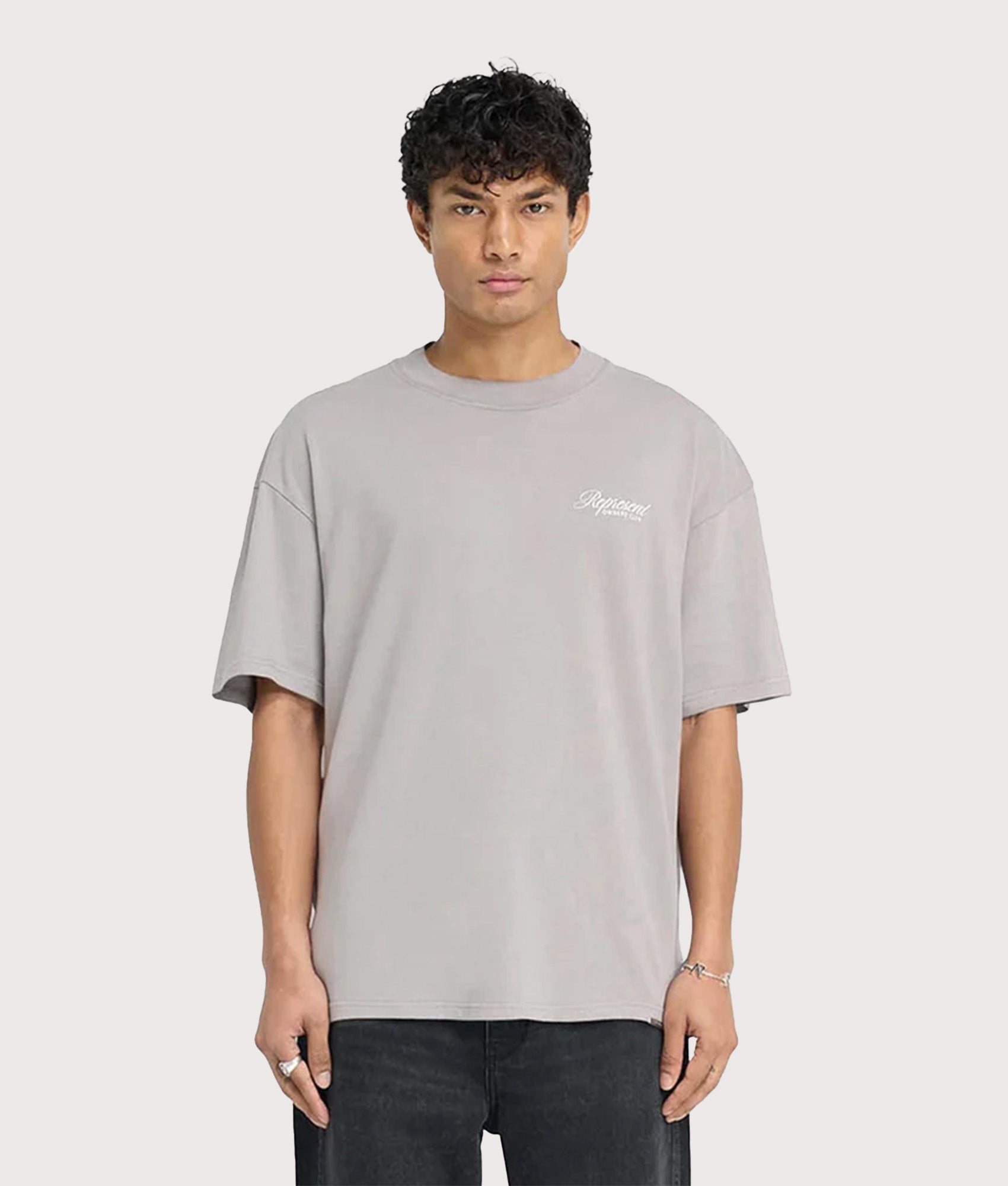 REPRESENT Oversized Represent Owners Club Script T-Shirt in Slate at EQVVS Menswear. Model front shot.