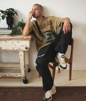 Relaxed-Fit-Formula-Baggy-Denim-Jeans-Black-PLEASURES-EQVVS-Campaign