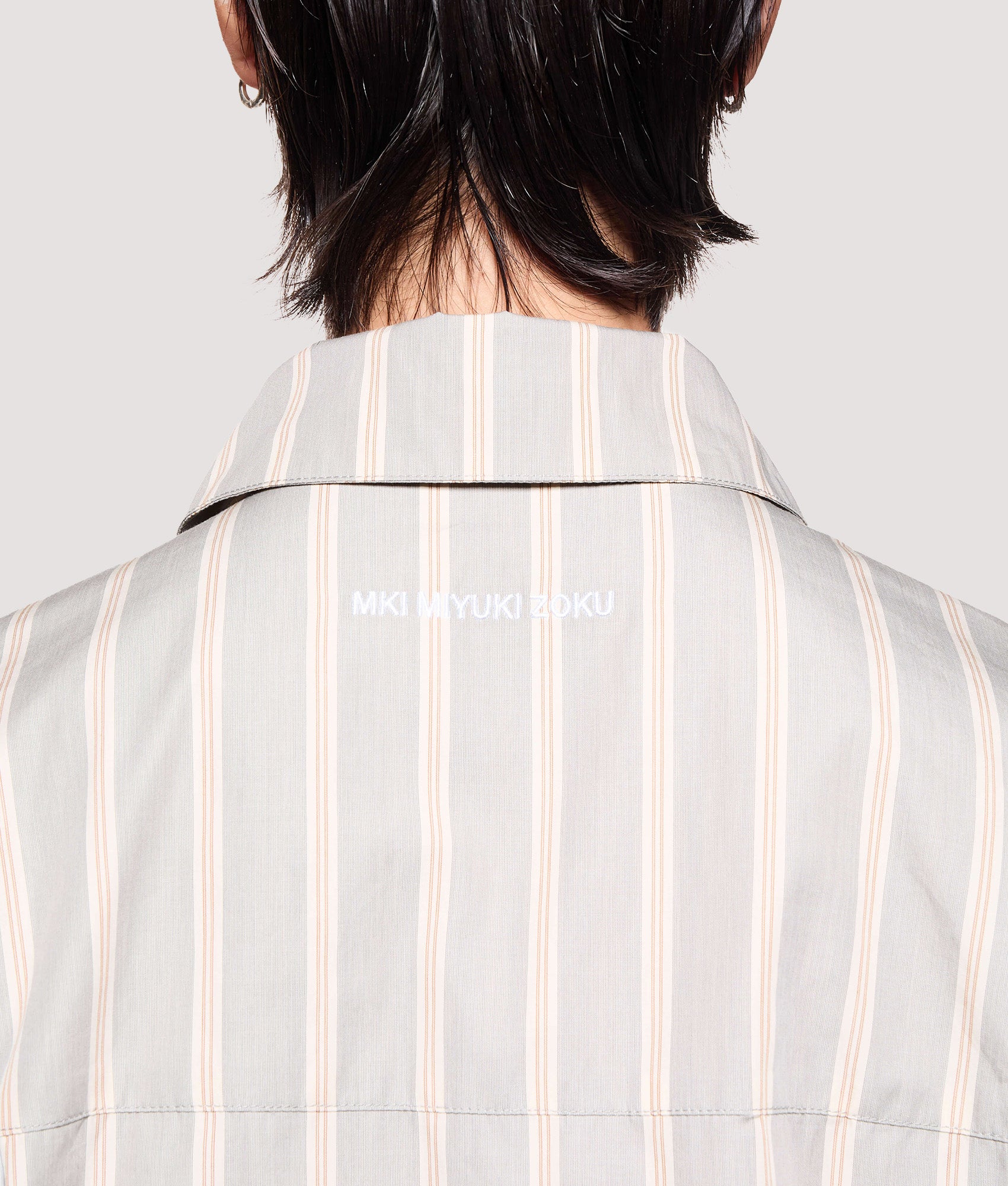 MKI MIYUKI ZOKU Box Fit Poplin Stripe Dress Shirt in Light Grey at EQVVS Menswear. Back detail shot.