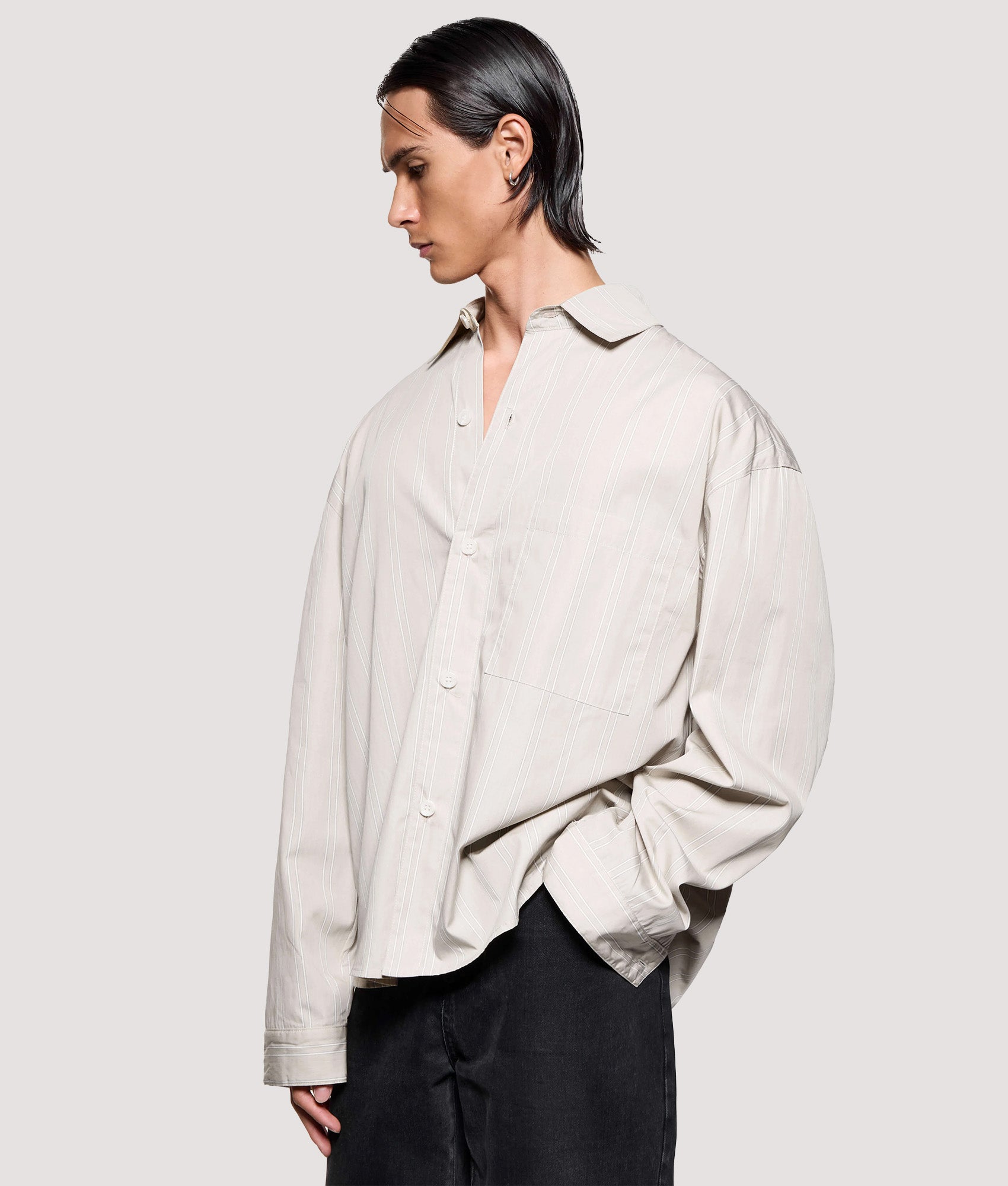 MKI MIYUKI ZOKU Box Fit Poplin Stripe Dress Shirt in Light Sage at EQVVS Menswear. Angled model front shot.