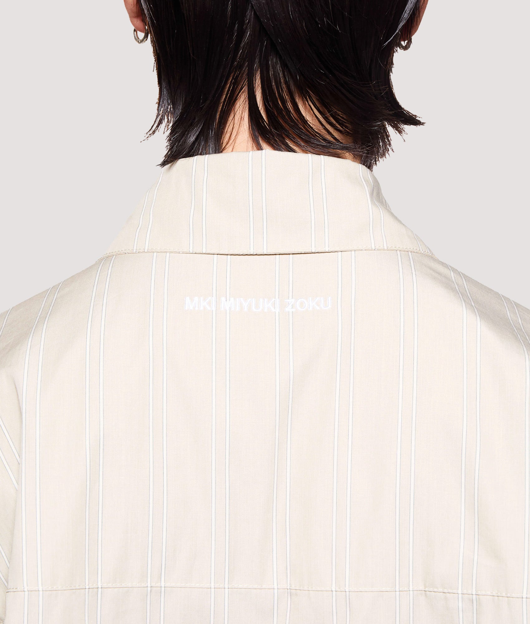 MKI MIYUKI ZOKU Box Fit Poplin Stripe Dress Shirt in Light Sage at EQVVS Menswear. Back detail shot.