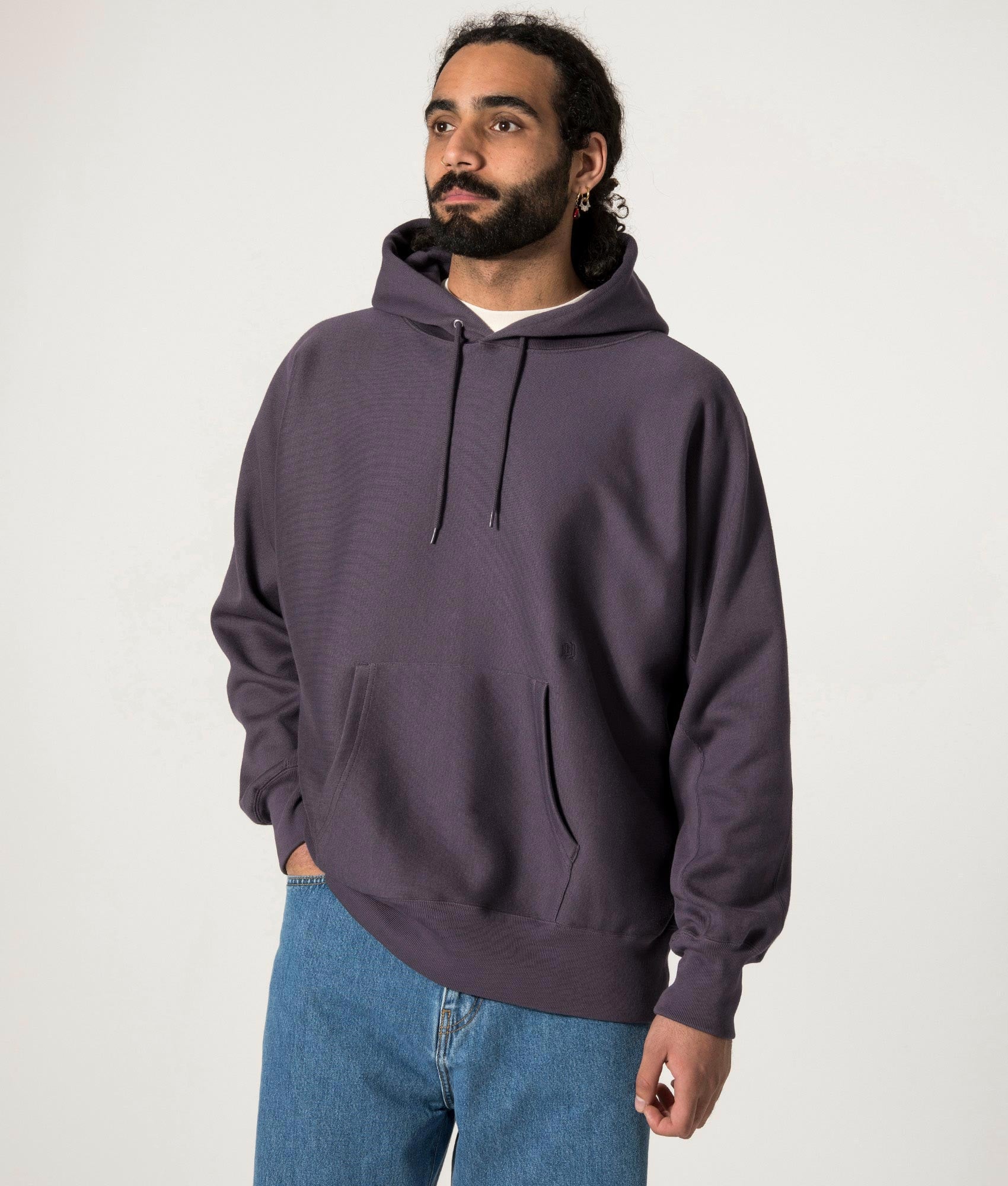 nanamica Hooded Pullover Sweat in Vintage Navy at EQVVS. Model Front Shot.
